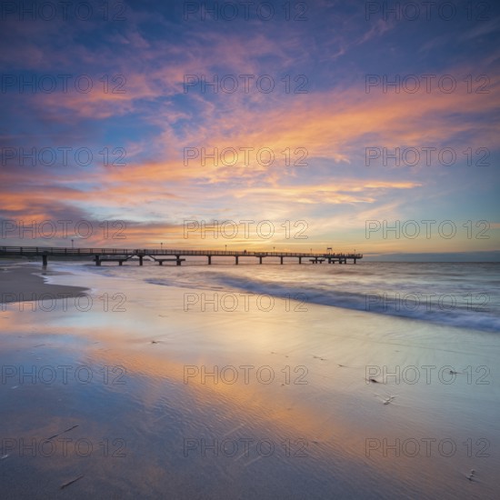 Pier on the fine sandy beach of the Baltic Sea at sunset, Baltic resort Rerik, Mecklenburg-Western