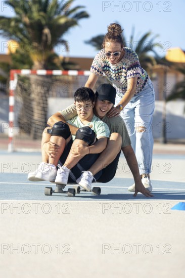 A Down syndrome teenager enjoys outdoor skateboarding with family support Laughter and joy fill the