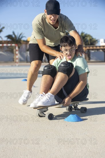 Down syndrome teenager skateboarding with his brother, enjoying an outdoor sports activity together