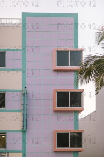Vibrant image showing a Miami Beach Art Deco building with pastel pink and turquoise colors