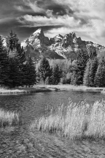 Dramatic black and white photograph capturing the rugged beauty of Grand Teton National Park,