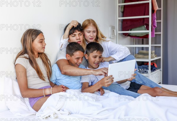 Five siblings, including a young teen woman, a young man, and triplet kids (a girl and two boys),
