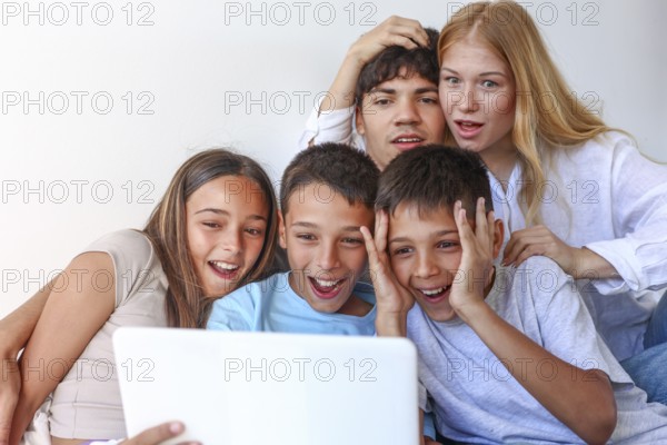 Five siblings, including a girl and two boy triplets, enjoy time with their elder brother and