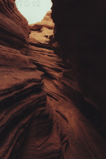 Striking volcanic landscape of Lanzarote, featuring rugged canyon formations with layered rock