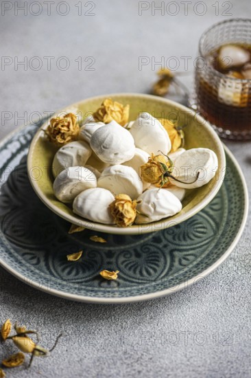 Homemade vanilla mini zephyr-marshmallows filled with rose jam, paired with a refreshing coffee