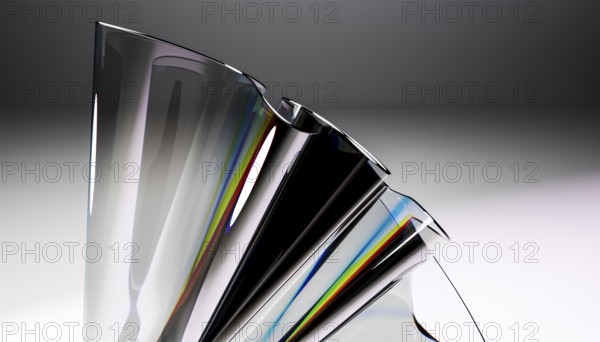 A close up of a sleek glass sculpture showcasing a stunning reflective prism effect. The dynamic