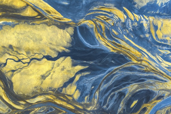 A mesmerizing blend of blue and yellow hues creates dynamic, fluid patterns, resembling natural