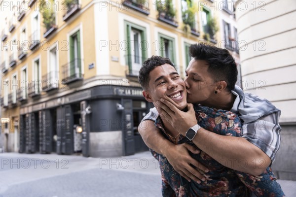 A joyful latin gay couple embraces in a cheerful moment while exploring the lively streets of