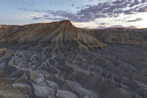Captivating vista of Caineville Mesa in Utah, USA, showcasing dramatic rugged terrain and striking
