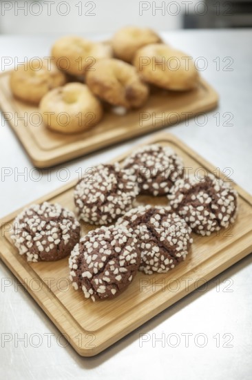 A charming Italian bakery setting with freshly baked cookies topped with sugar crystals and golden