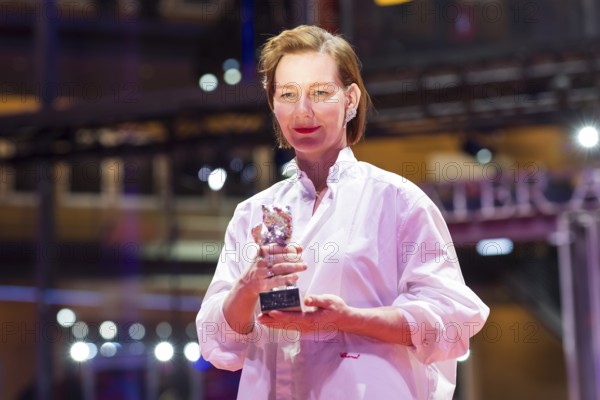 Sandra Hüller poses with the Silver Bear for the best acting performance in a leading role in the