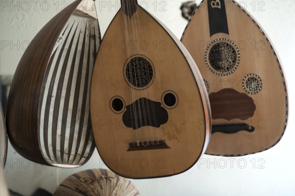 Istanbul, Turkey. April 13th 2017 Handmade Oud hanging inside the window display of Veysel Muzik
