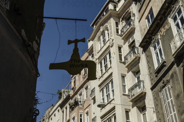 Istanbul, Turkey. 14th May 2015 The Works Antique shop sign hangs in front of typical European