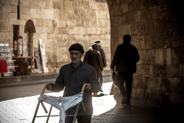 Istanbul, Turkey. November 21st 2023 A Turkish worker pushes a trolley cart near the Egyptian