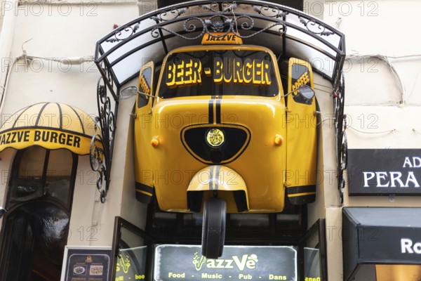 August 2nd 2021 Istanbul, Turkey Quirky Yellow Sign for Jazz Ve Beer and Burger Bar near Istiklal