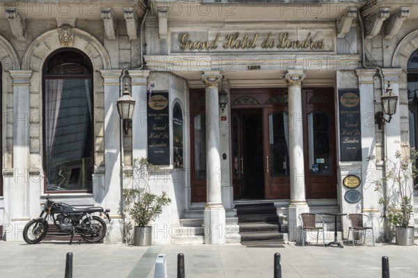 August 2nd 2021 Istanbul, Turkey An Antique motorbike parked outside The Grand Hotel de Londres in