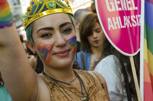 Istanbul, Turkey. 28th June, 2015 A young Turkish woman with rainbow face paint celebrates Gay