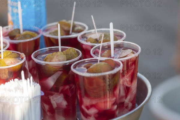 Glasses of fermented pickle juice for sale beside fish restaurants in Istanbul, the popular