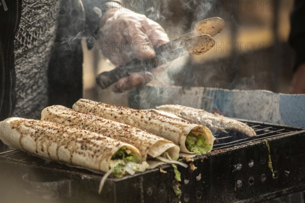 Istanbul, Turkey. November 29th 2020 Grilled fish wrap sandwiches cooking on a stall outside in