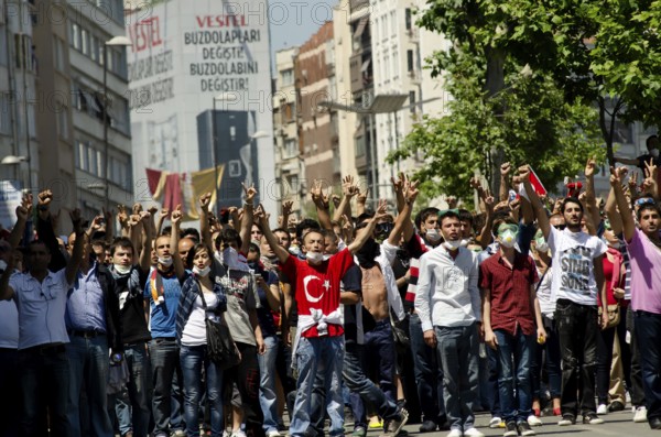 Istanbul, Turkey. June 1st 2013 Turkish protestors confront police with hand gestures during the
