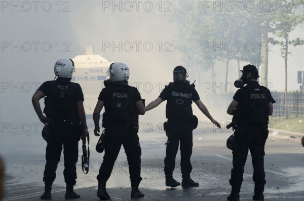 Istanbul, Turkey. June 1st 2013 Turkish riot police in clouds of tear gas, Gezi park, Taksim