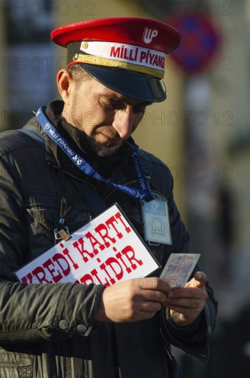 Istanbul, Turkey. December 19th 2014 A man selling Turkish lottery tickets near Takism square,