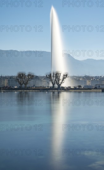 A tranquil shot of Geneva's iconic Jet d'Eau fountain, majestically rising above Lake Geneva