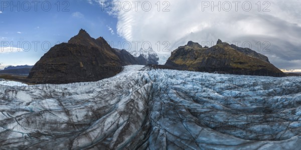 Stunning panoramic view of Vatnajokull National Park's glacier, capturing the rugged beauty of