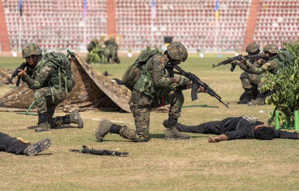 Personnel of the Central Reserve Police Force simulate a counter-terror operation, as they