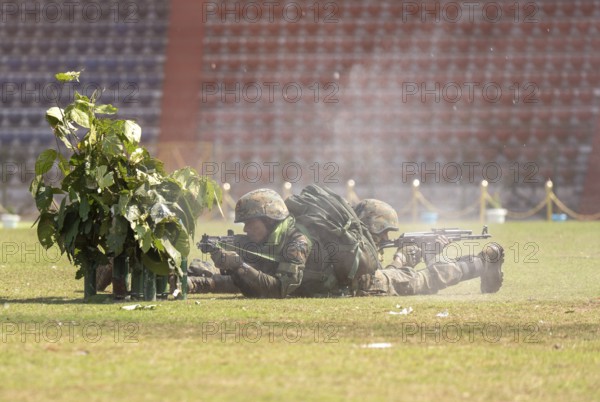 Personnel of the Central Reserve Police Force simulate a tactical operation as he taking position