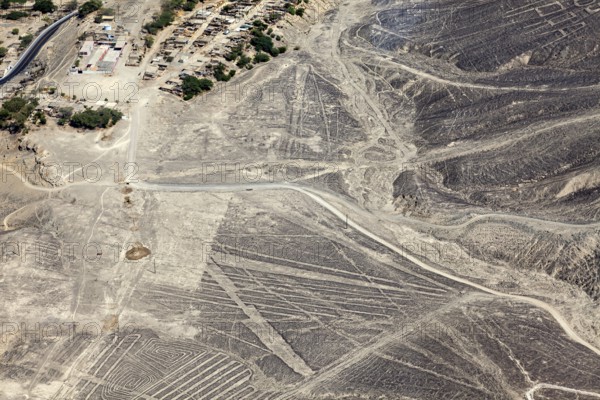 Aerial view of a dry desert landscape with the famous Nazca lines in Peru, the geoglyphs and images