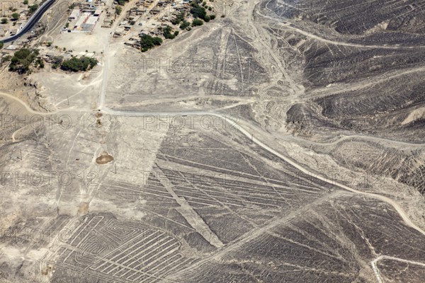 Desert landscape with visible Nazca lines seen from above in Peru, The geoglyphs and images in the