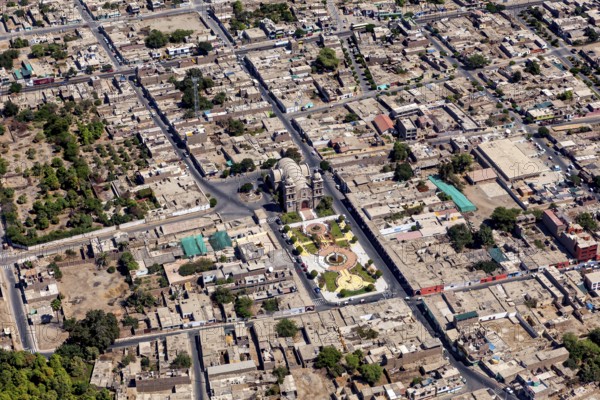 Aerial view of a city with clearly visible roads and buildings, details of urban planning visible,