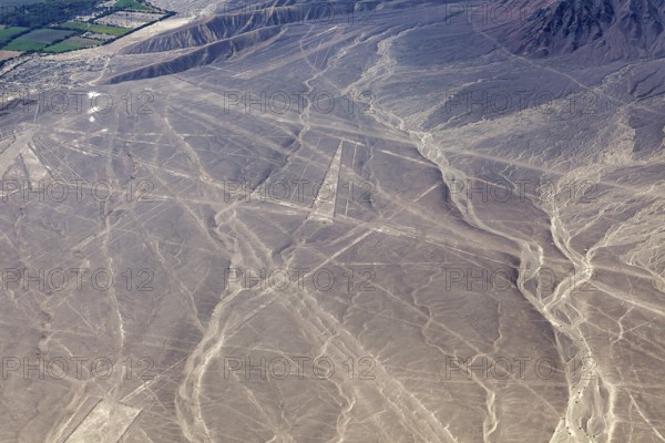 Aerial view of Nazca lines in a dry desert landscape with distinctive geoglyphs, the geoglyphs and