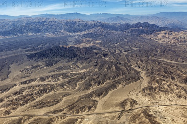Extensive mountainous desert landscape with barren hills and valleys, the desert landscape near