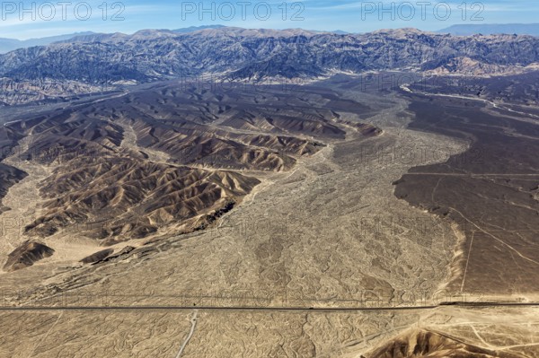 View of vast desert plains and mountain ranges from the air, The desert landscape near Nasca in