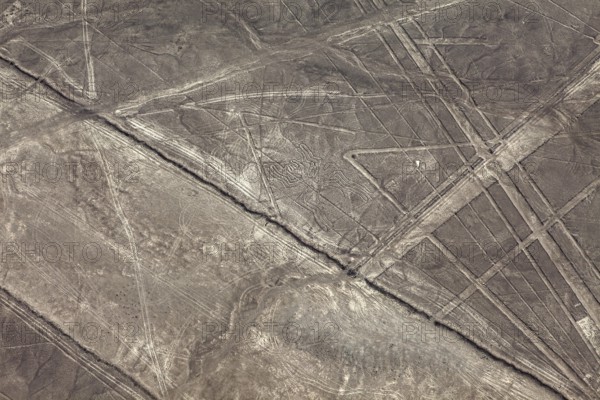 Lines and patterns form on a dry desert surface, the geoglyphs and drawings in the desert near