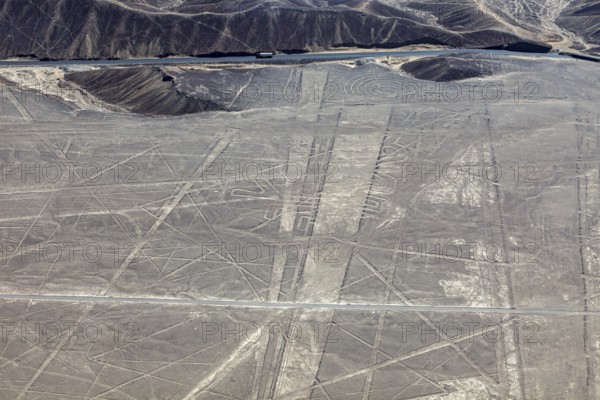 View of lines and patterns on a sandy, dry surface, the geoglyphs and drawings in the desert near