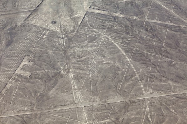 Aerial view of the Nazca lines with visible geometric shapes in the desert, the geoglyphs and