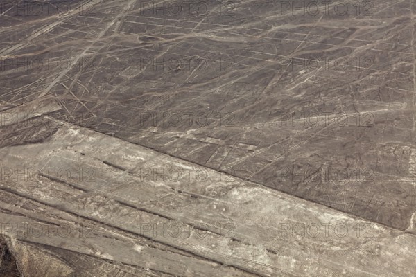 Dry desert area with the Nazca lines and simple geometric patterns, the geoglyphs and drawings in
