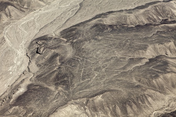 Dry desert with puzzling lines that cover the mountain and form geometric figures, the geoglyphs