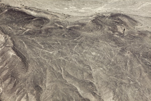 View of barren desert landscape with visible ancient line patterns, geoglyphs and drawings in the