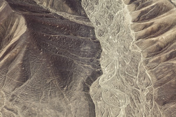 Hilly desert landscape with visible ancient lines from the air, the geoglyphs and paintings in the