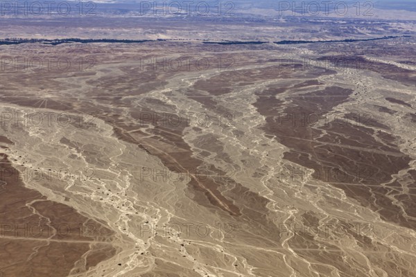 Desert landscape with genetic patterns that criss-cross the soil, the landscape and desert near
