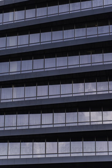 A detailed close-up showcasing the modern architectural design of a building's exterior. The image