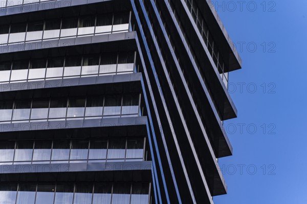 From below image highlights the geometric details of a modern skyscraper. The repeating patterns