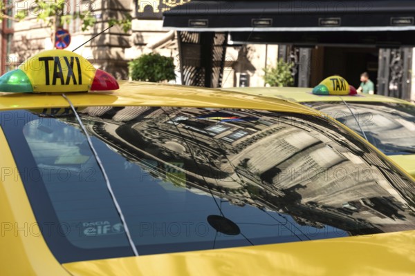 Bucharest, Romania. October 29th 2023. Romanian Taxi cabs parked outside a popular restaurant in