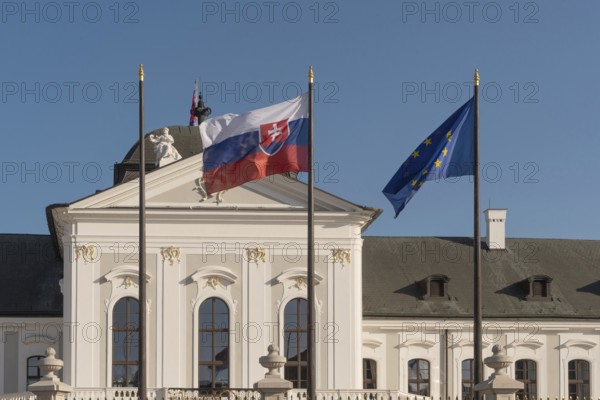 Bratislava, Slovakia. October 3rd 2023 Slovak and EU flags fly outside The Grassalkovich Palace.