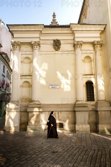 Bratislava, Slovakia. October 2nd 2023 A Nun walking towards the Franciscan Church, Old Town,