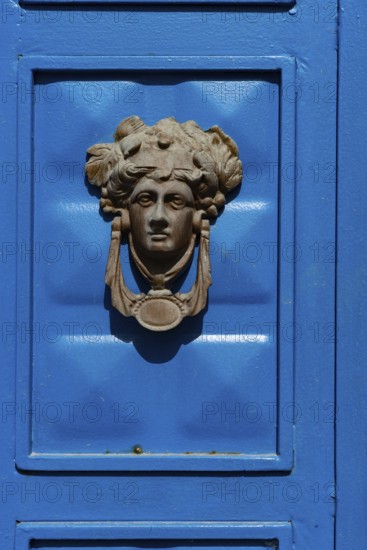 Bodrum, Mugla, Turkey. April 22nd 2022 Beautiful blue door with a Greek mythological icon as a door
